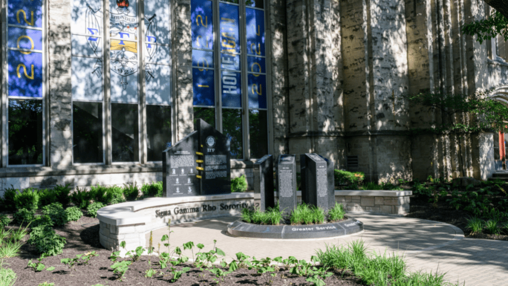 Sigma Gamma Rho Founders' Plaza monument in front of Sigma Gamma Rho windows at Atherton Union