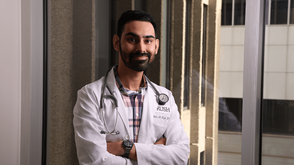 Male physician in lab coat, Rush on the coat. stethoscope around neck. dark hair, beard and mustache