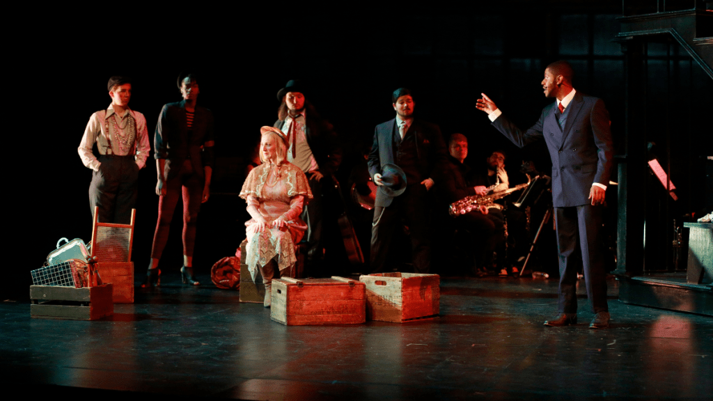 Student actors on stage during a play