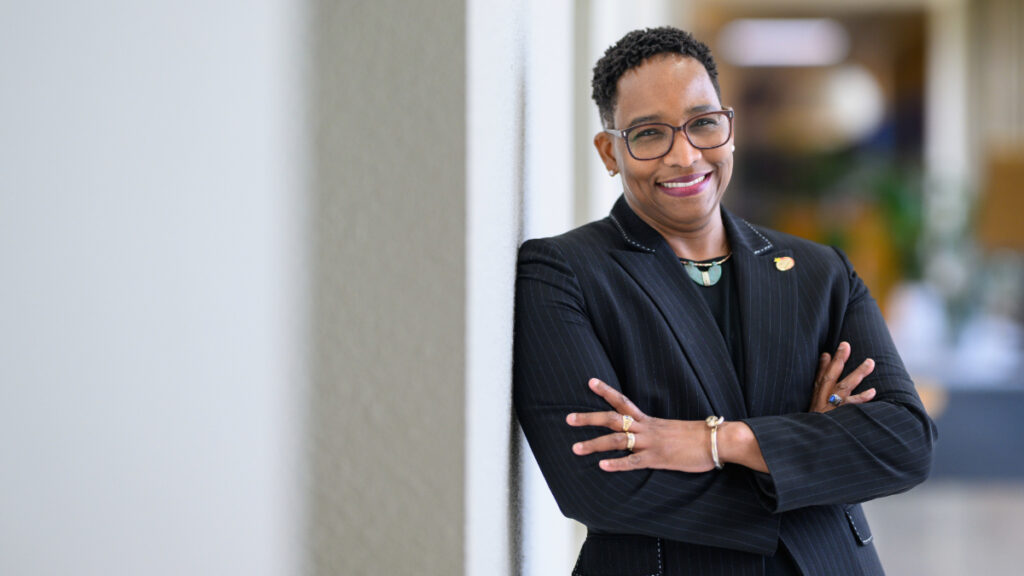 Headshot of Butler's Founder's College Dean, Caroyln Gentle-Genitty, wearing a black blazer and a green stone necklace.