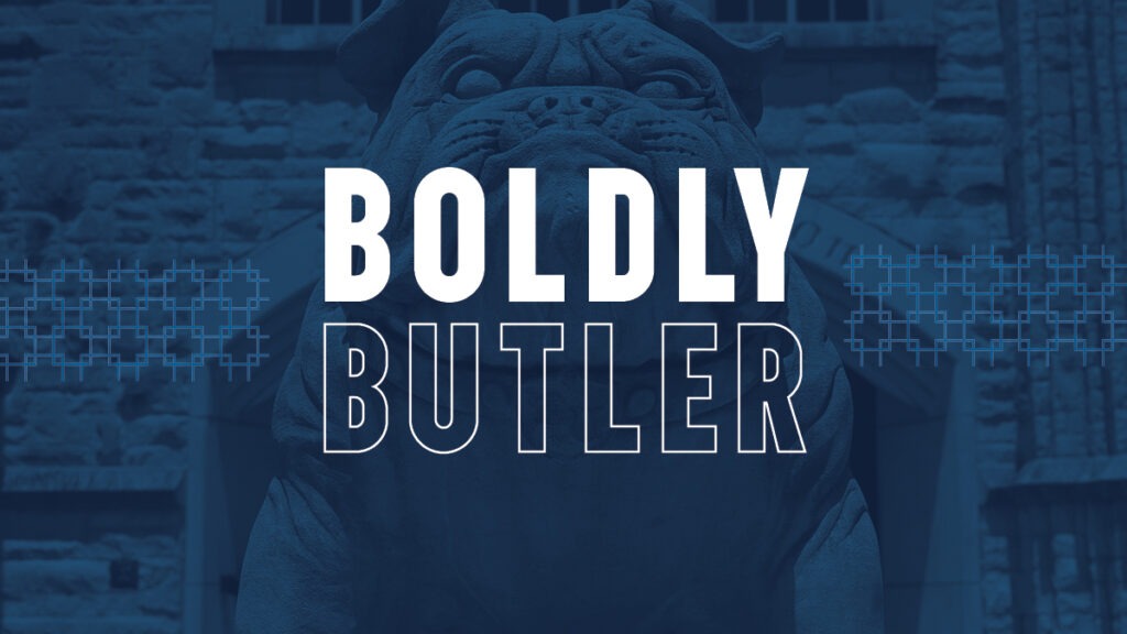 The words Boldly Butler in front of an image of a bulldog statue at Butler University