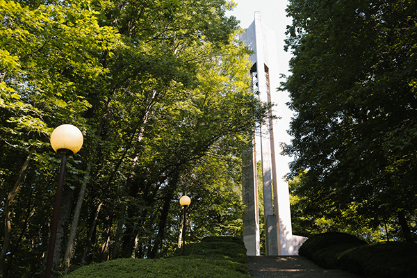 Butler Carillon structure among green trees and lampposts