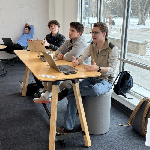 Butler Entrepreneurship students on computers at a table together