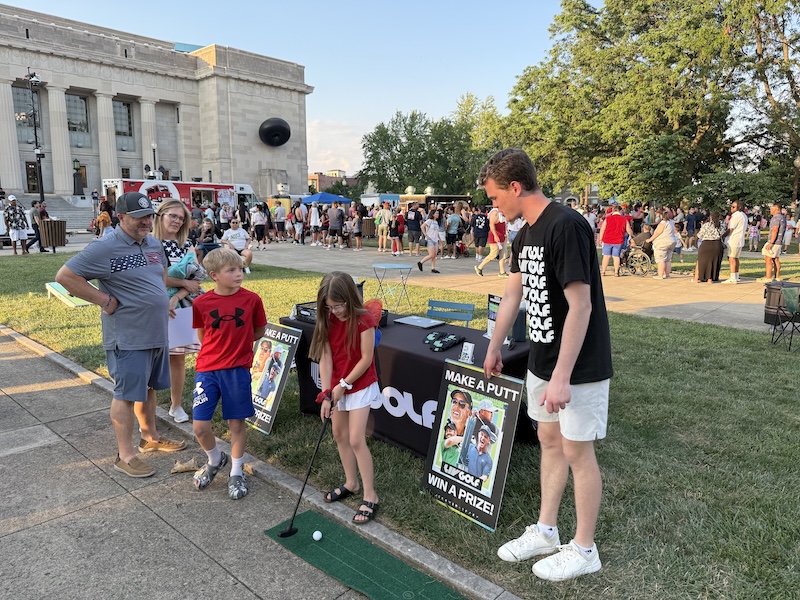 Picture of Butler University students at a golfing event with a putting game