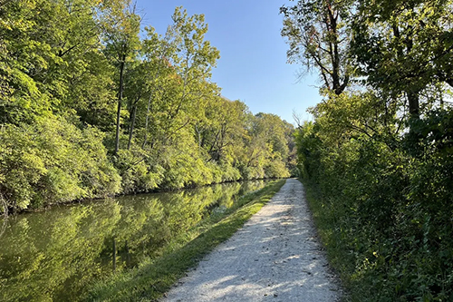 Canal with limestone towpath adjacent to it.