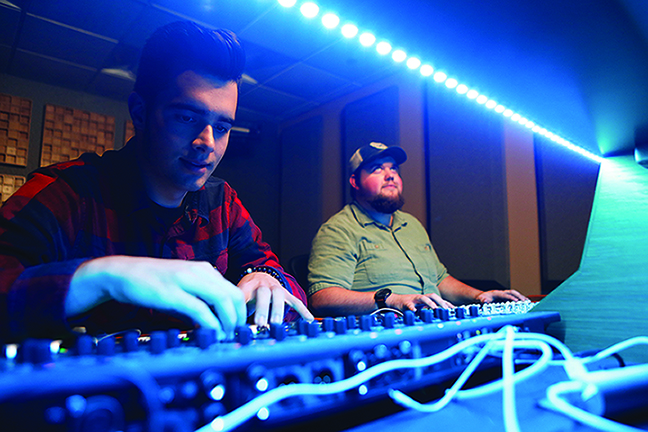 students at a mixing board