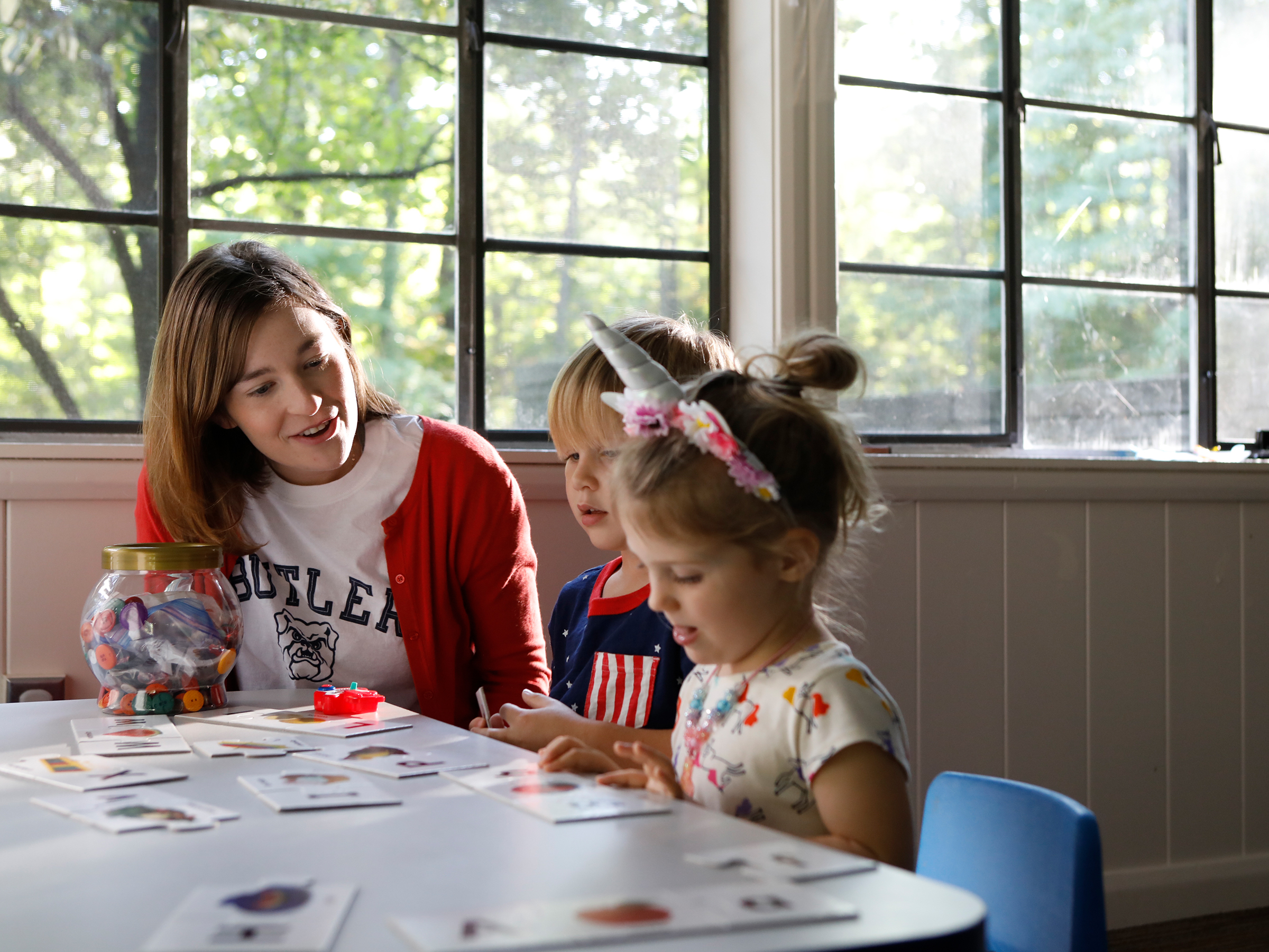 COE student meets with young children