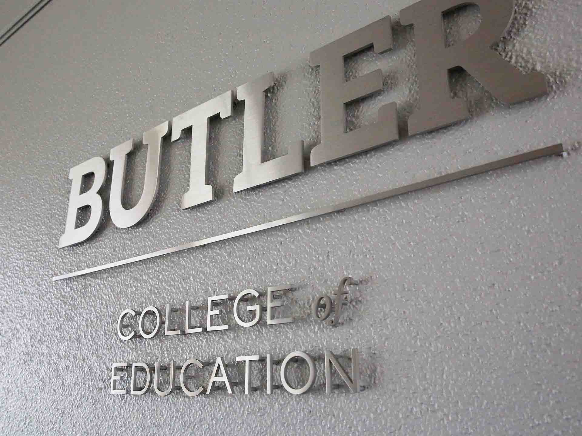 The words "Butler College of Education" attached to a wall.