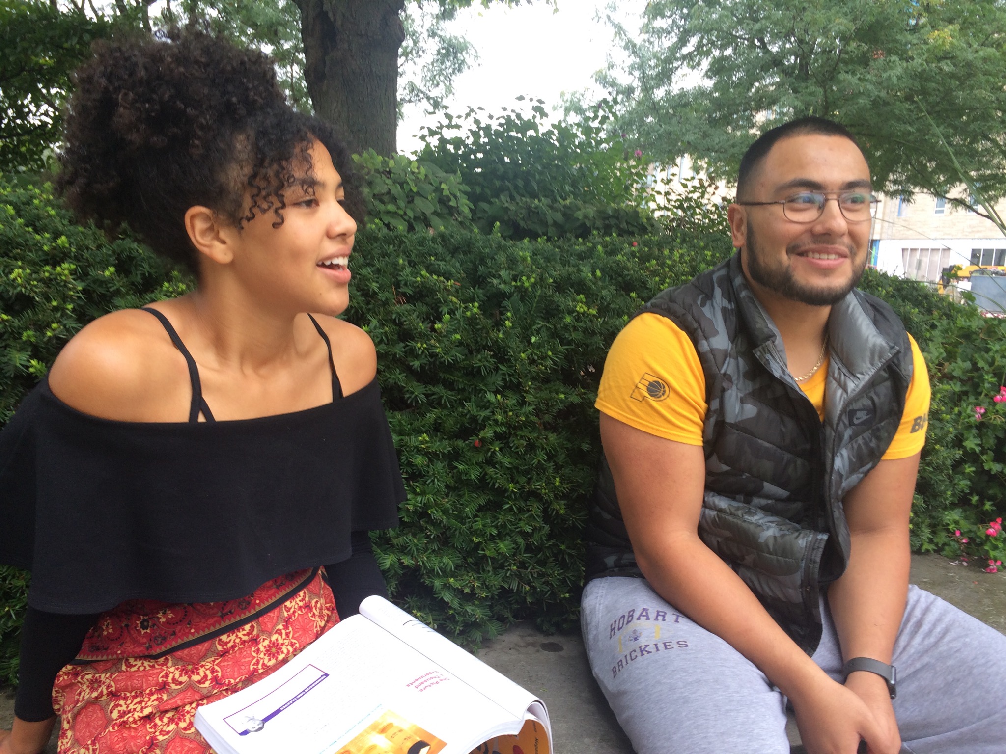 two students hanging out outside