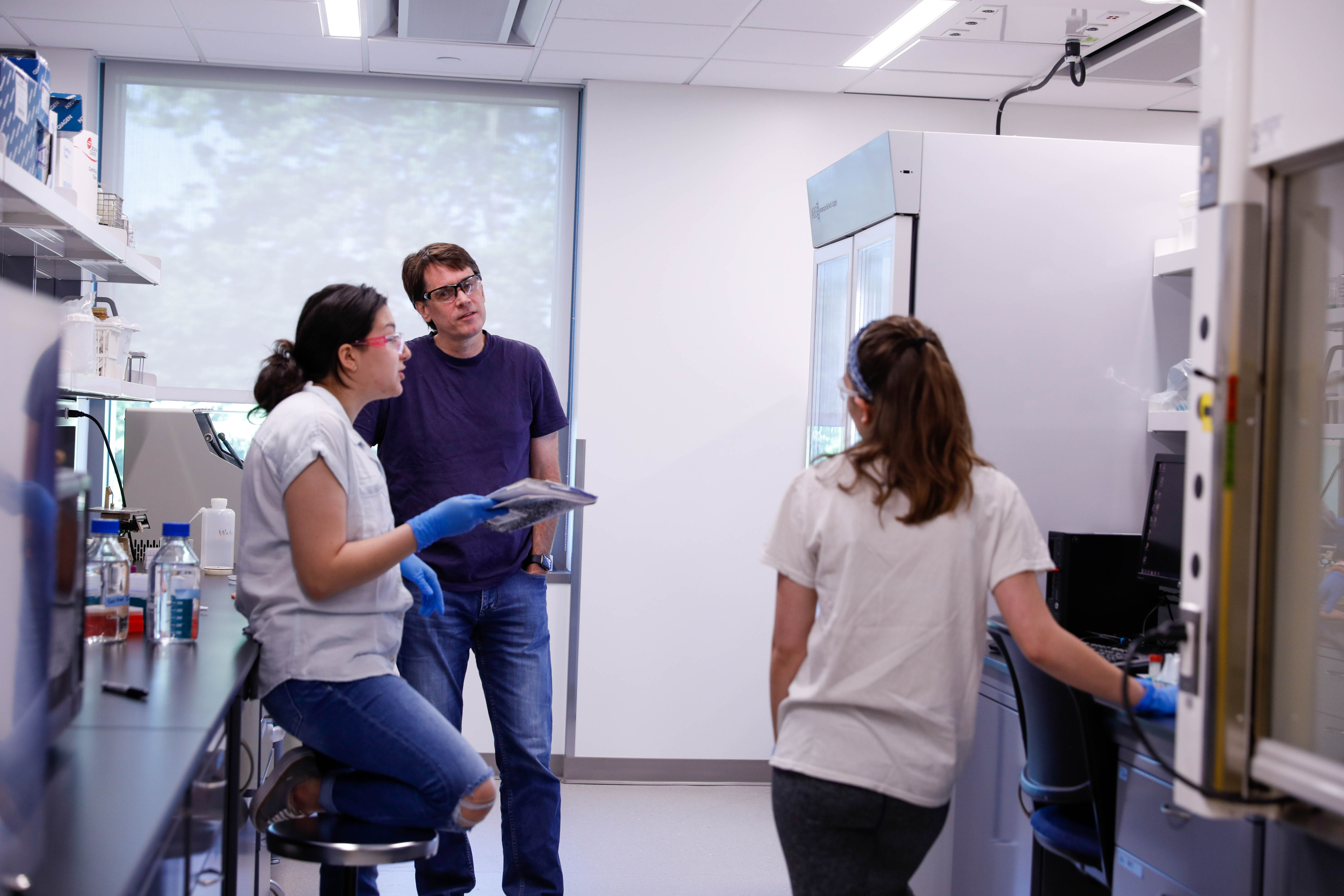 Students engaging with each other in a lab