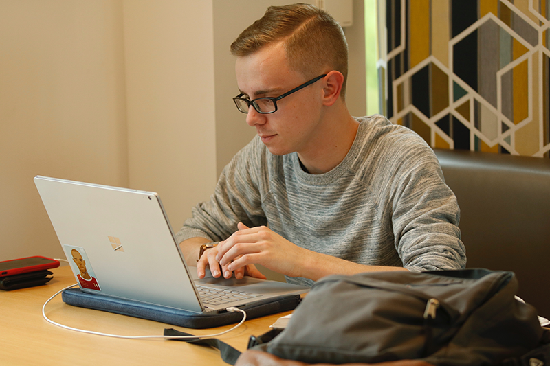 Butler student on his computer