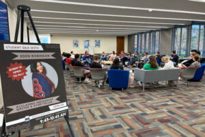 Eden Robinson answers questions in large, brightly-lit room of event attendees.