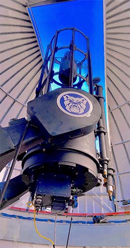 Holcomb Observatory telescope with open dome.