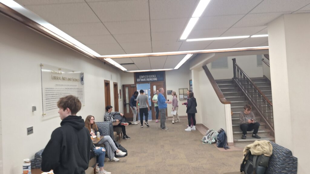 Students and faculty outside the main CSSE entrance on the second floor of Jordan Hall.