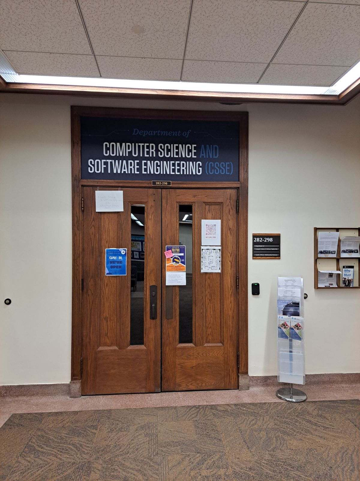 Main double-door entrance to the office suite for the Computer Science & Software Engineering department.