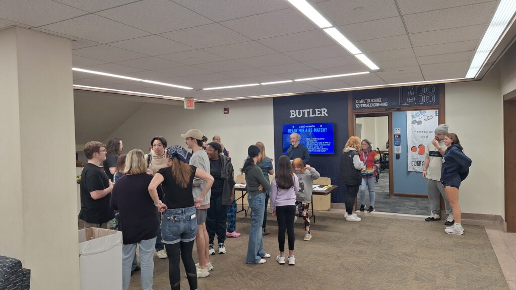 Students, faculty, and staff congregating in Jordan Hall outside the computer science labs.