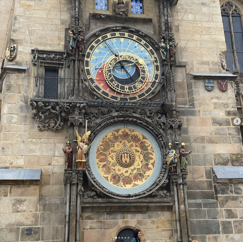 Close-up of a clock on a building in downtown Prague