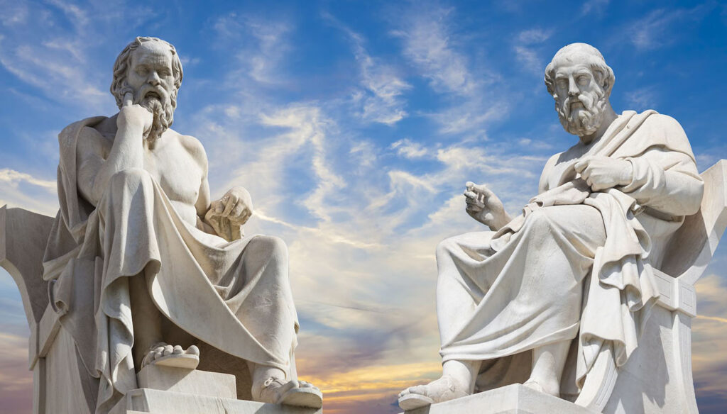 Statues of two philosophers, set against a view of the sky.