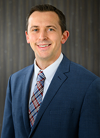 Portrait of Derek McMichael.