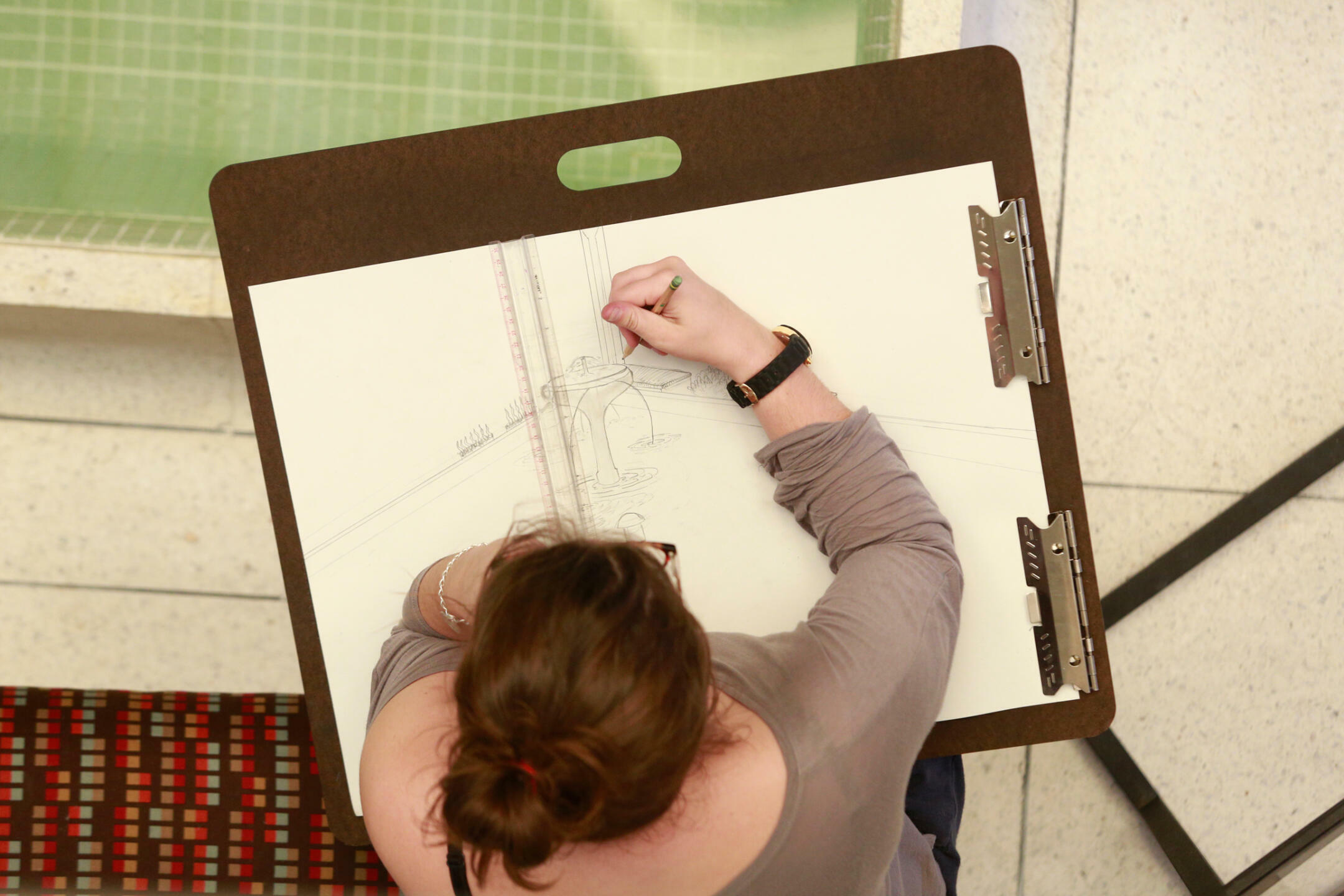 student sketching on paper