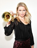 Bria Skonberg holding trumpet.