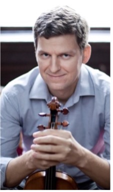 James Ehnes holding a violin.
