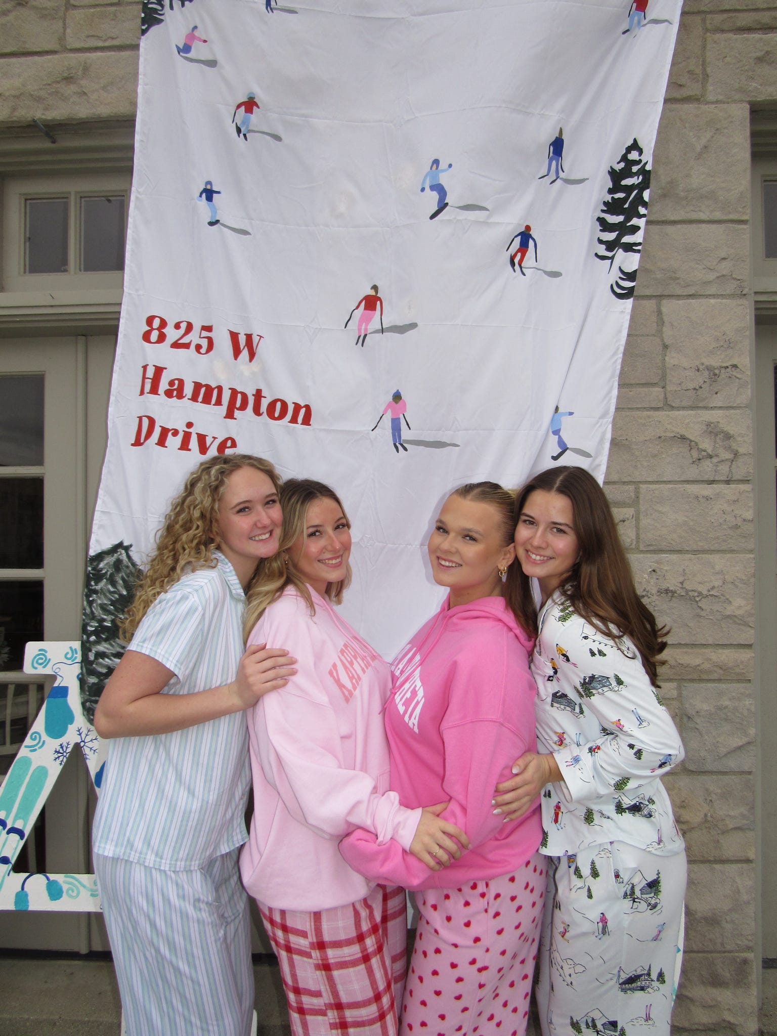 4 women outside sorority house