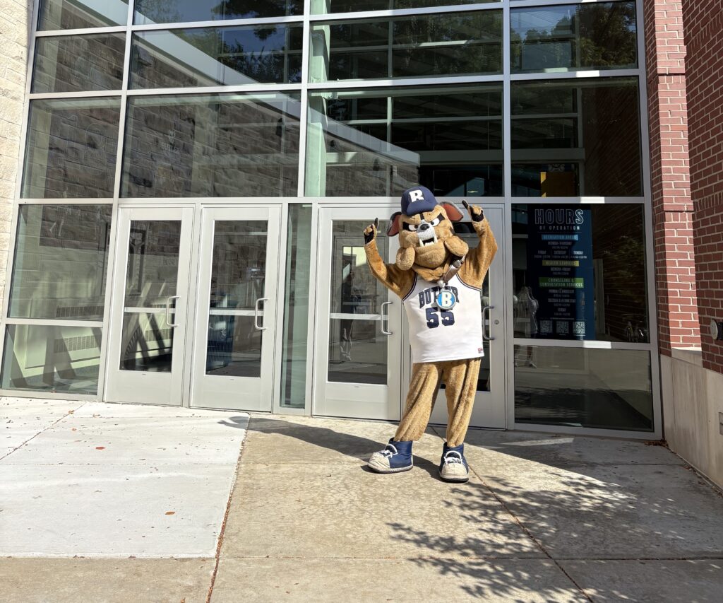 Hink waving at the entrance to the HRC