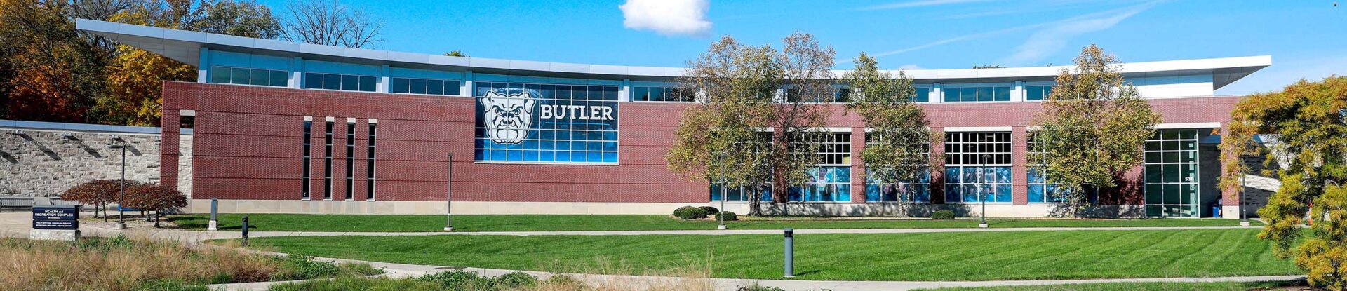 Front view of the brick facade of the Butler Health and Recreation Complex on a sunny early autumn day.
