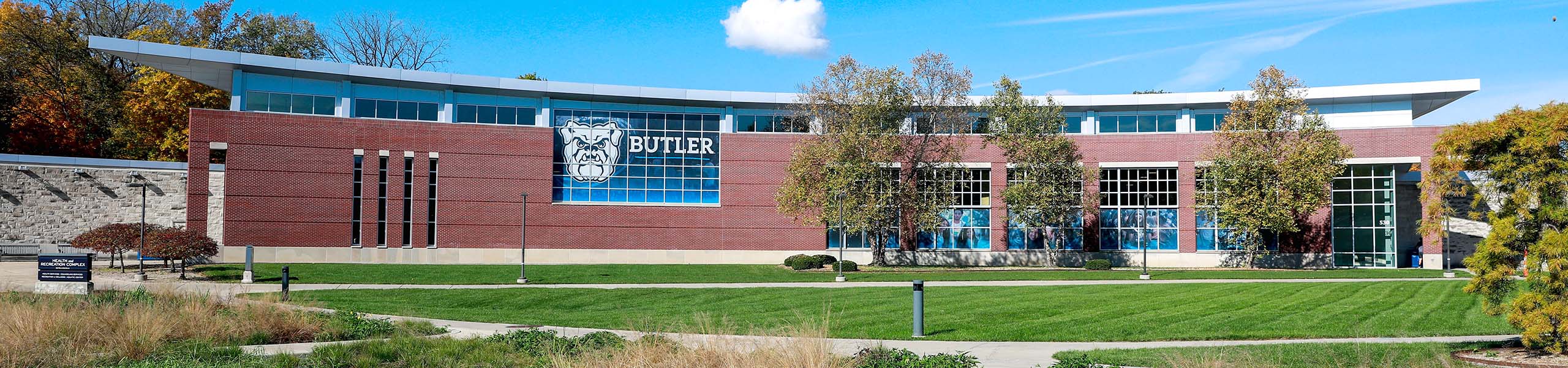Front view of the brick facade of the Butler Health and Recreation Complex on a sunny early autumn day.