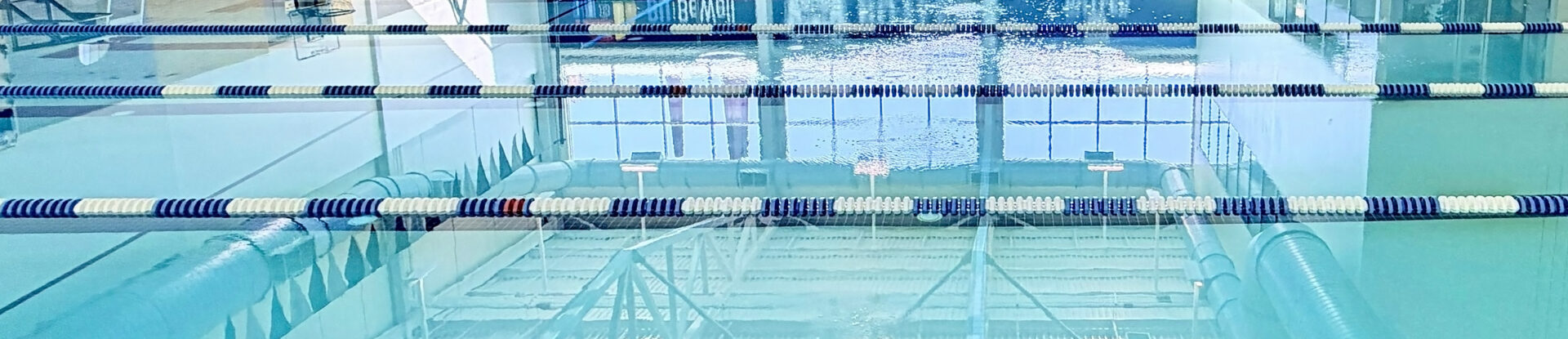 Butler Aquatic Center lap pool swimming lanes with blue and white dividers separating them.