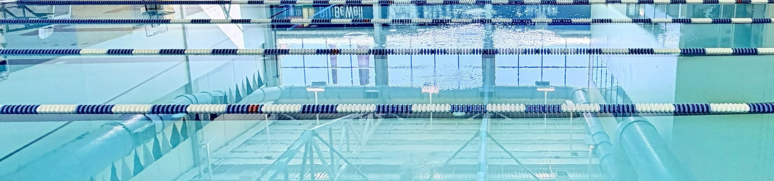 Butler Aquatic Center lap pool swimming lanes with blue and white dividers separating them.