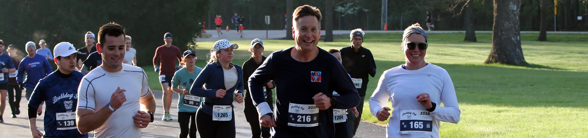 Runners smiling as they participate in the 2026 Bulldog Jog event.