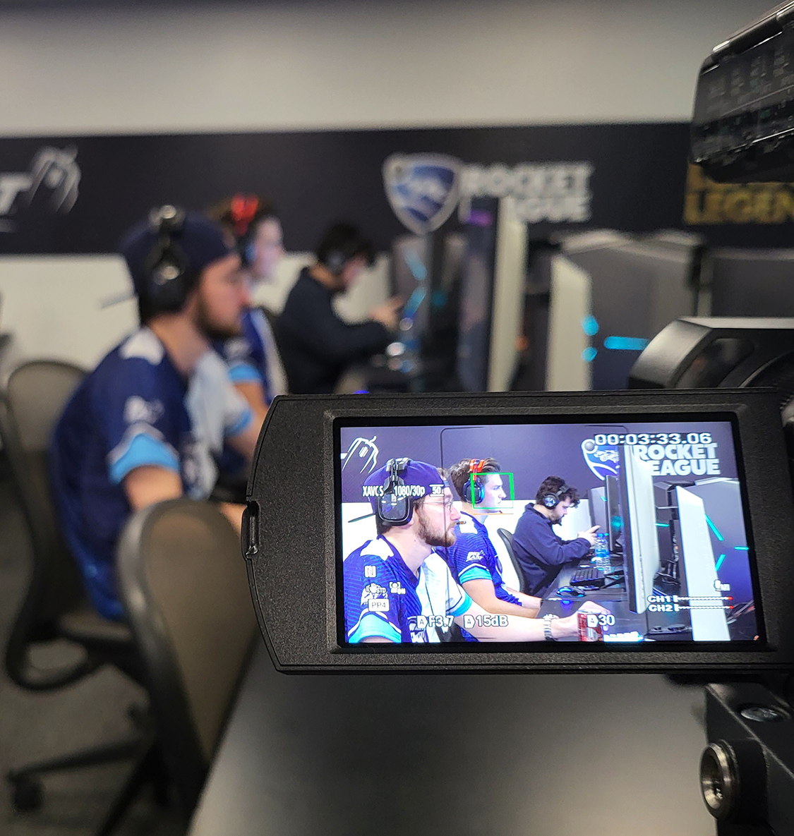 esports player being filmed by another student