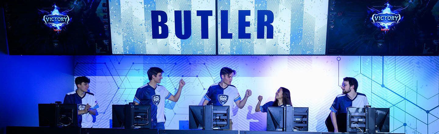 E-sports team exchanging fist bumps