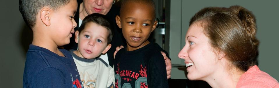 a student talking to young children