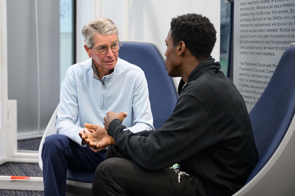 Butler faculty member listens to a Founder's College student while sitting and having a conversation.
