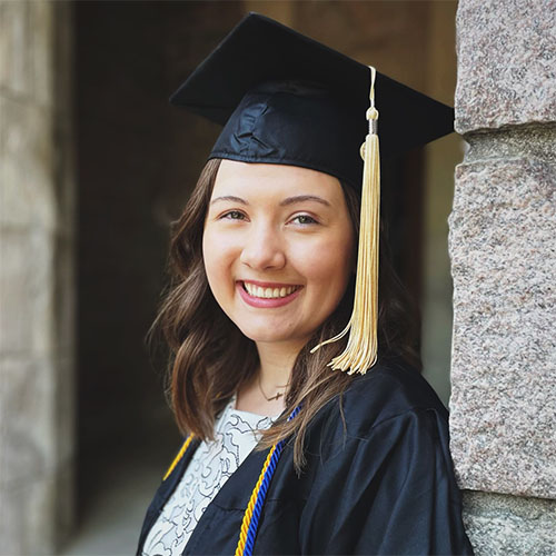 Lindsay Marohn smiles wearing a black graduation cap and gown.
