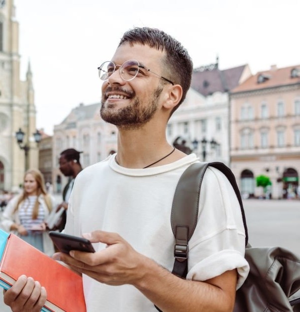 Image of person with notebooks traveling