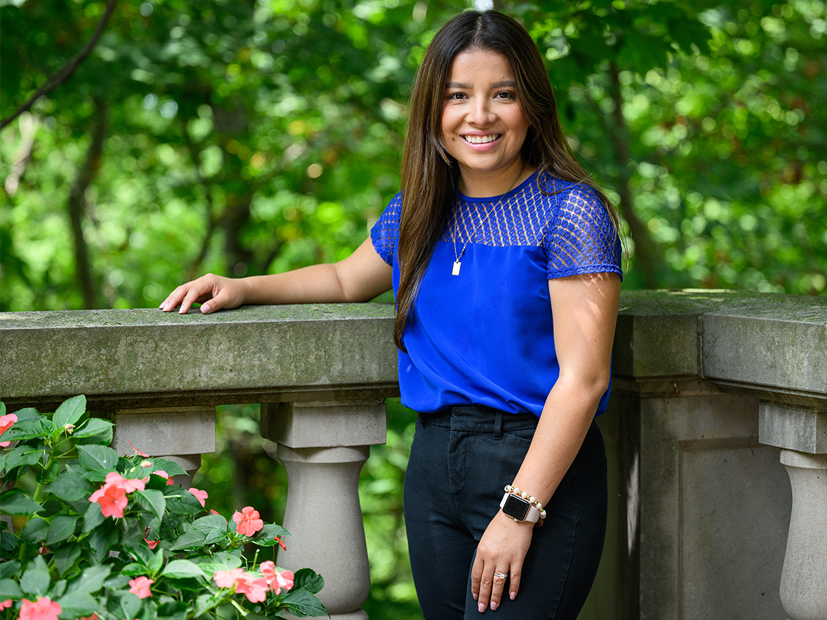 woman wearing royal blue shirt posing