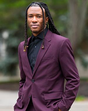 Tez Lately standing outside