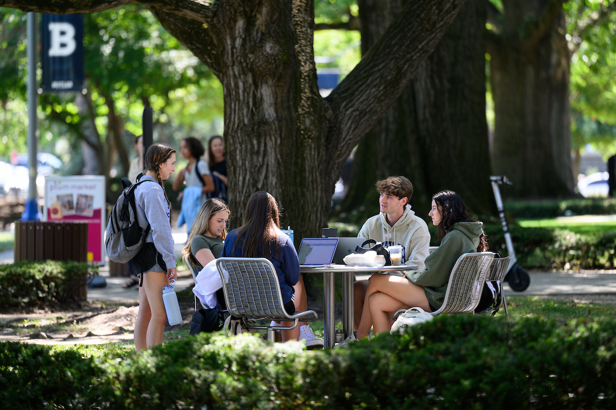 Students seated around a table at Atherton Union.