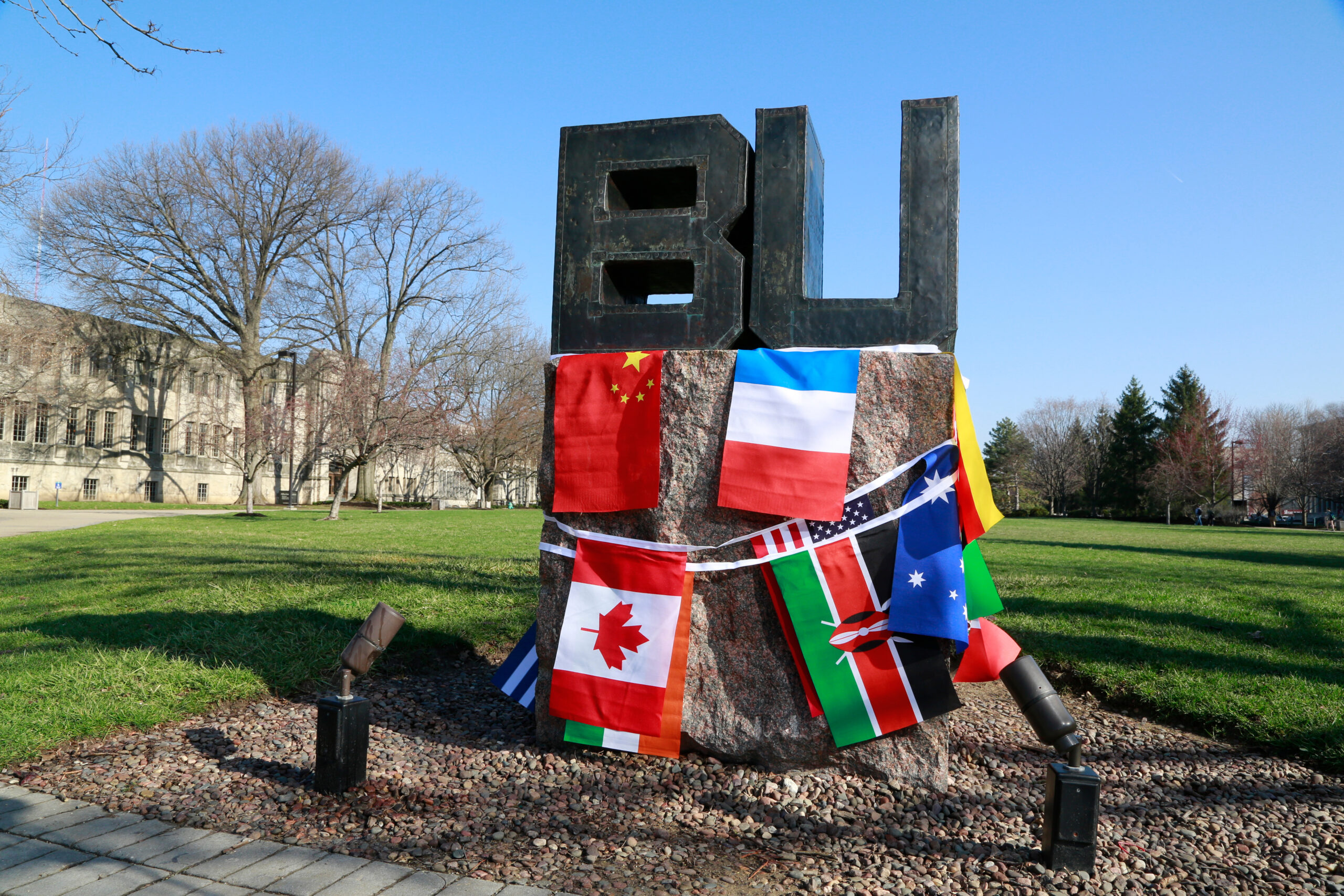 BU sign with international flags