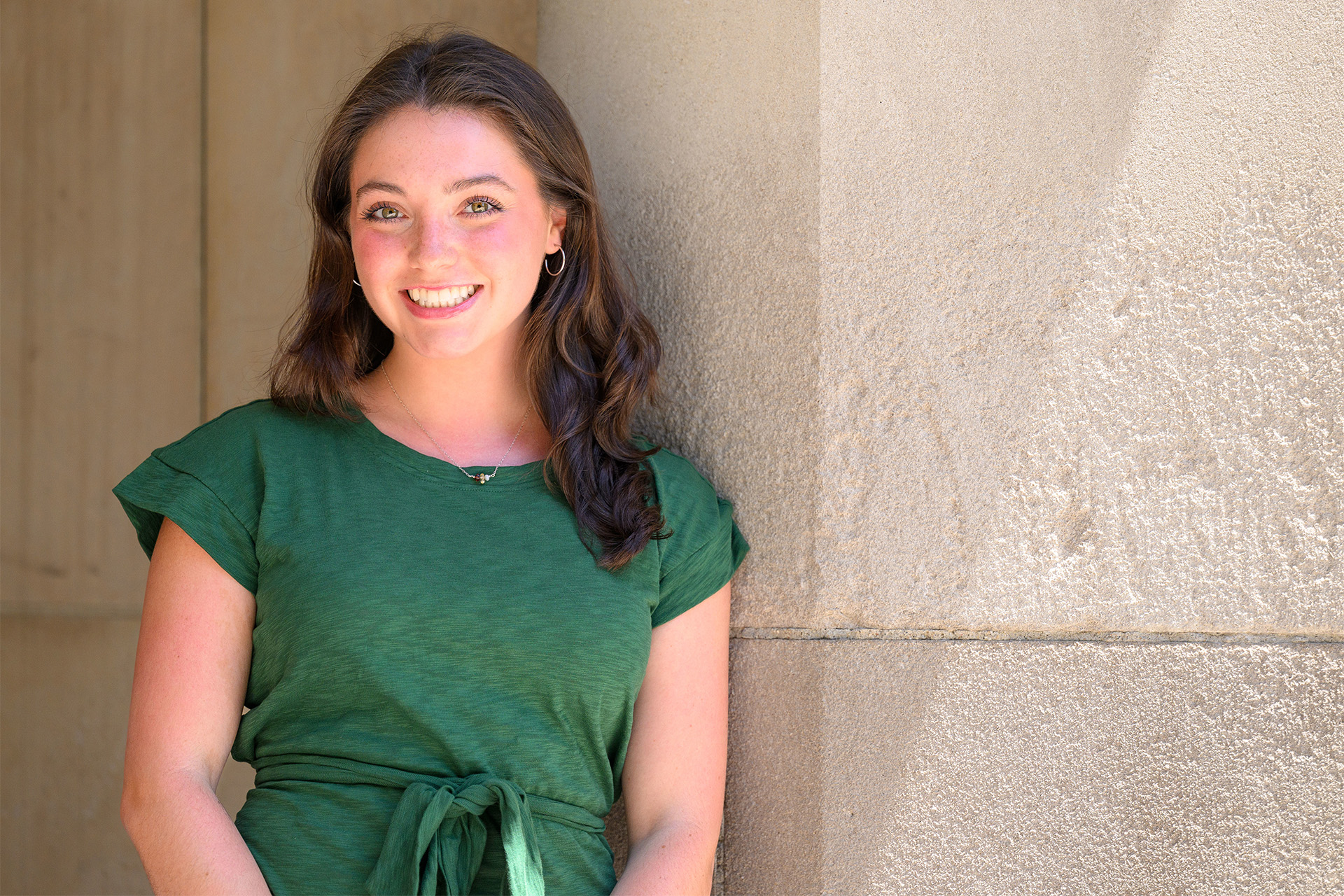 Caroline, admission counselor, outside on campus