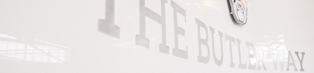 Marble wall with "The Butler Way" engraved on it