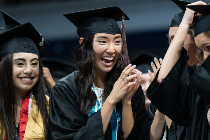 A Butler student smiles and celebrates during commencement ceremonies.